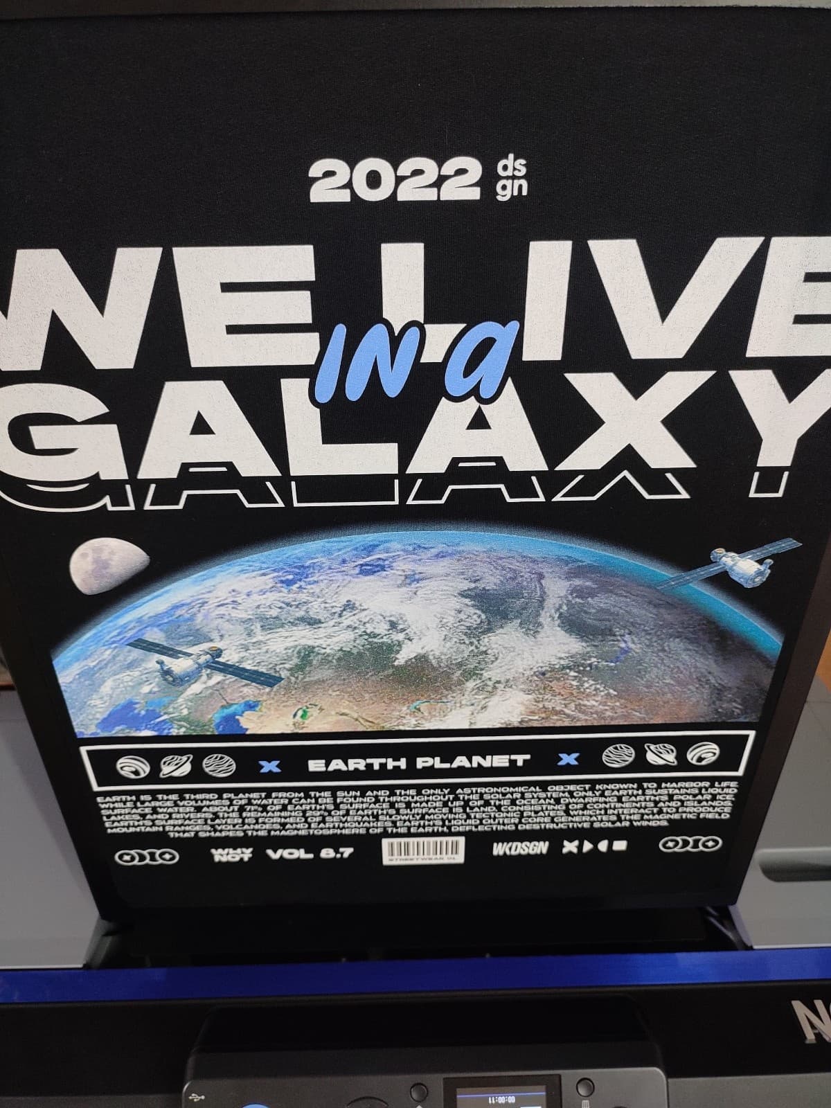 Close-up of hybrid print using DTF logo and DTG base design